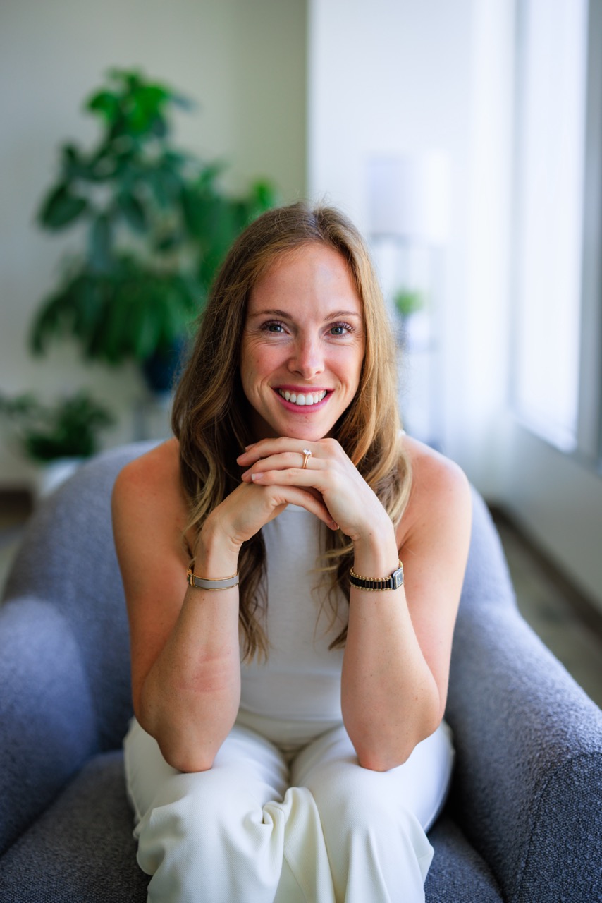Rebecca, founder of OT by the Sea, smiling warmly in a sunlit West LA home
